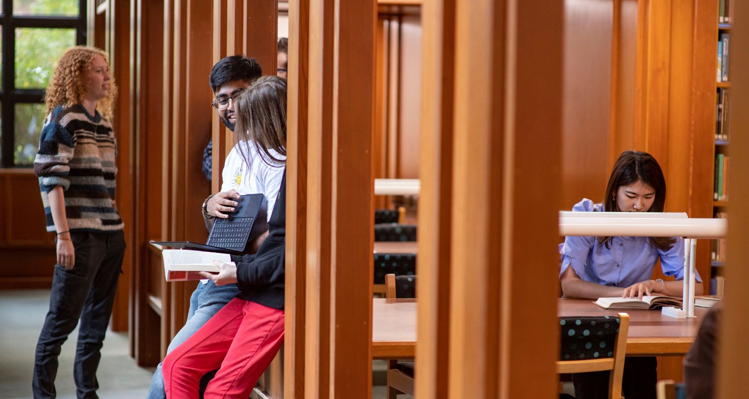 Students studying in the College library