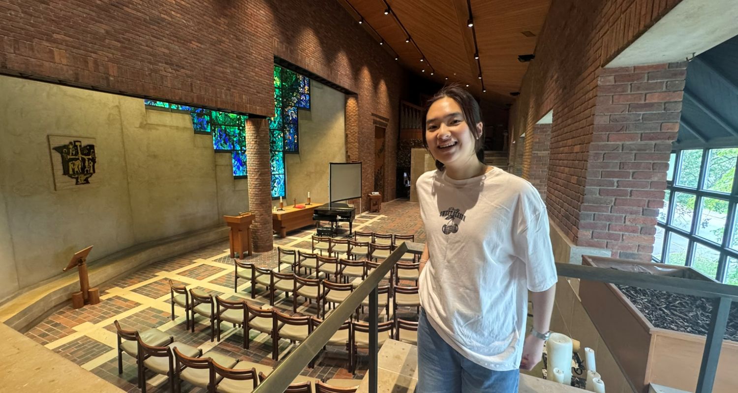 A student smiling in College