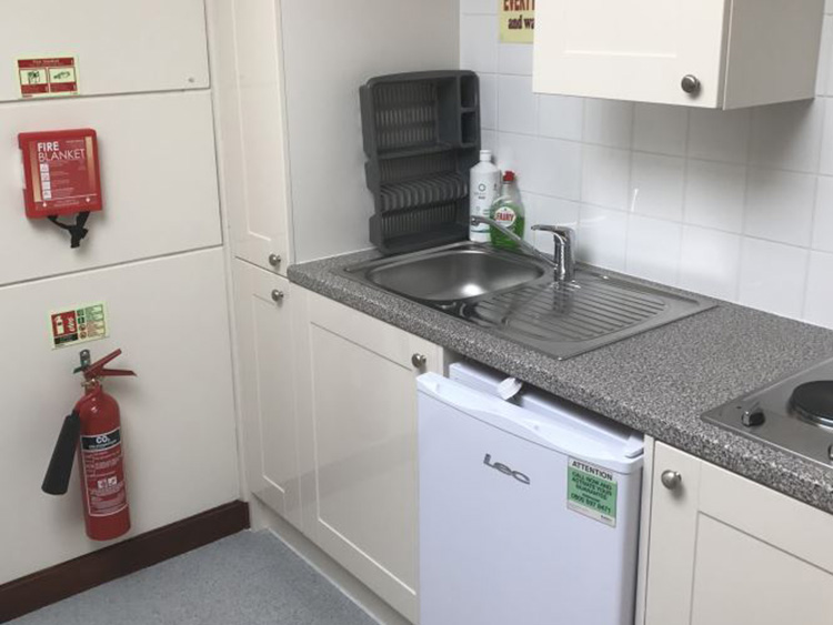 Example of a Staircase Kitchen