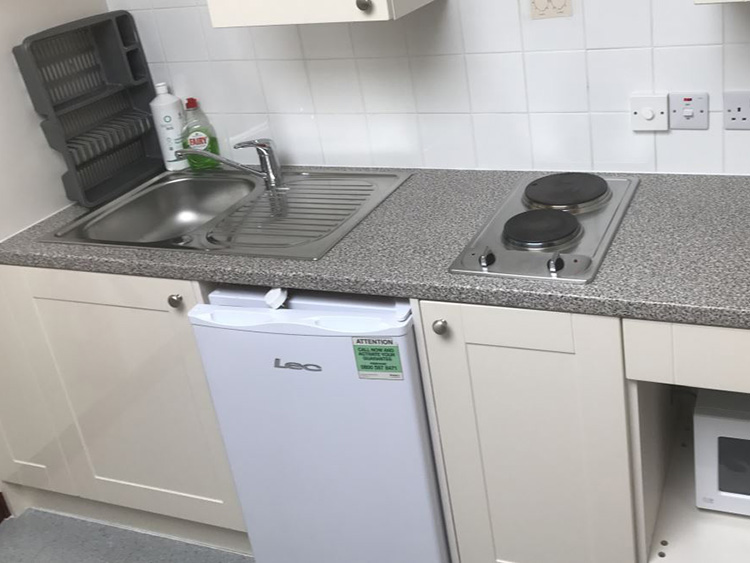 Example of a Staircase Kitchen