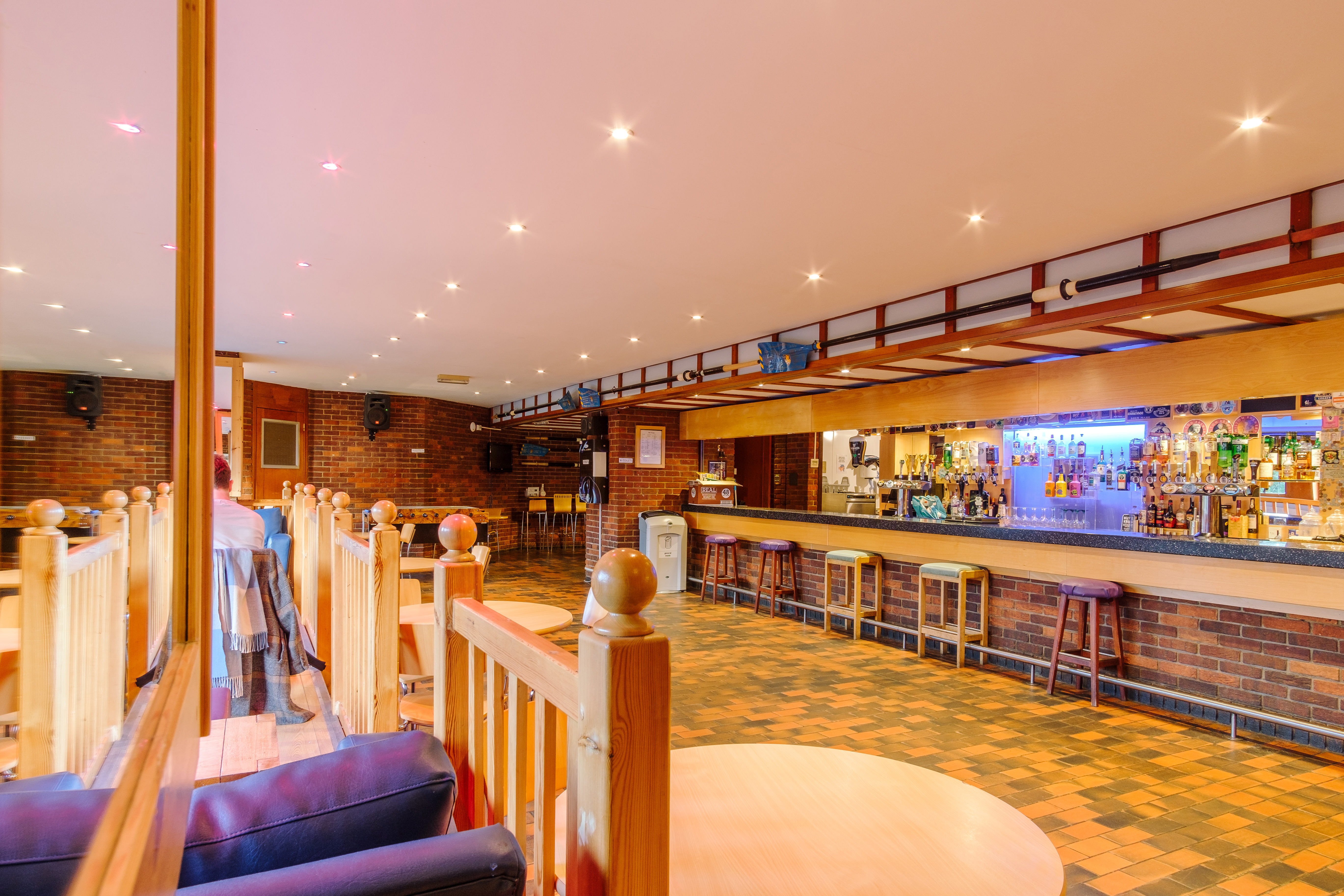 The brick-lined bar and seating area inside Robinson College, home of the Red Brick Café Bar