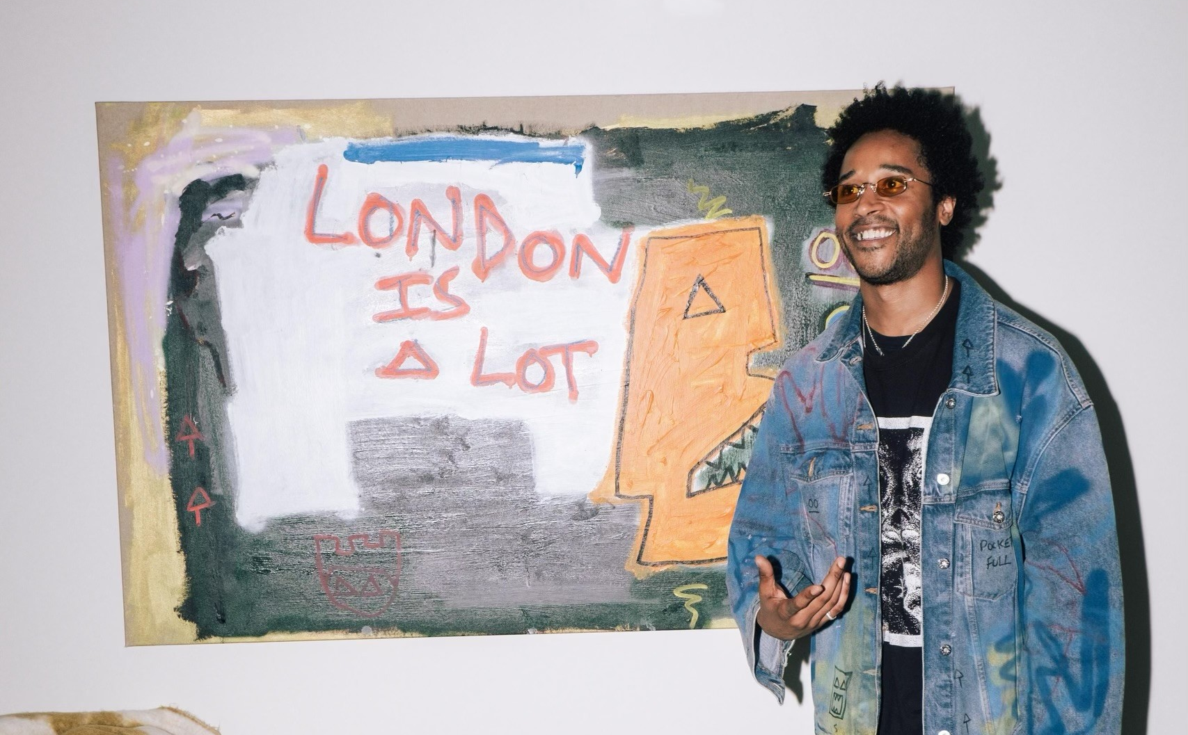 Painter SHEM in front of 'London Is A Lot' Painting