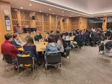 Groups of students sitting at round tables