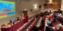 A group pf students listening to a talk in an auditorium