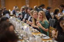 Guest sitting at long tables for a formal dinner