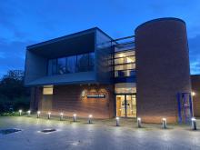 A modern teaching and conference building of red brick and glass